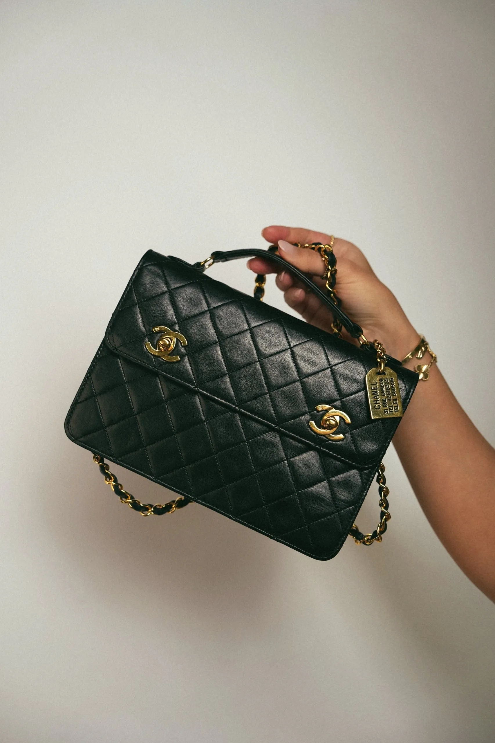 Black Lambskin Quilted Top Handle Double Turnlock Single Flap Gold Hardware