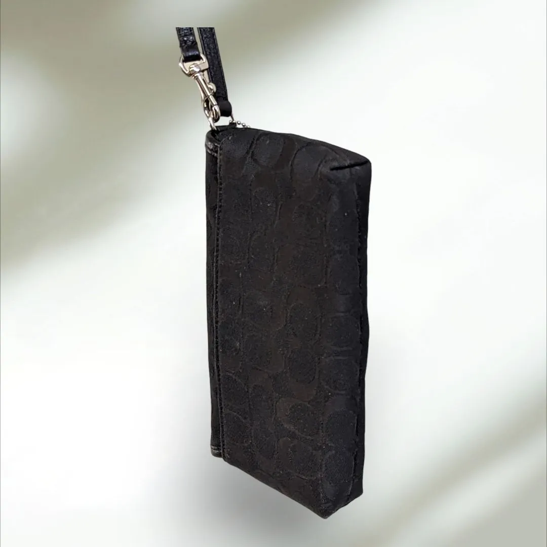 COACH Signature large flap Wristlet
