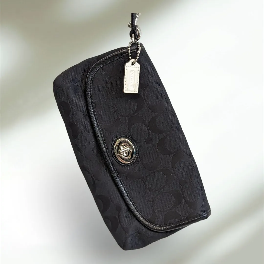COACH Signature large flap Wristlet
