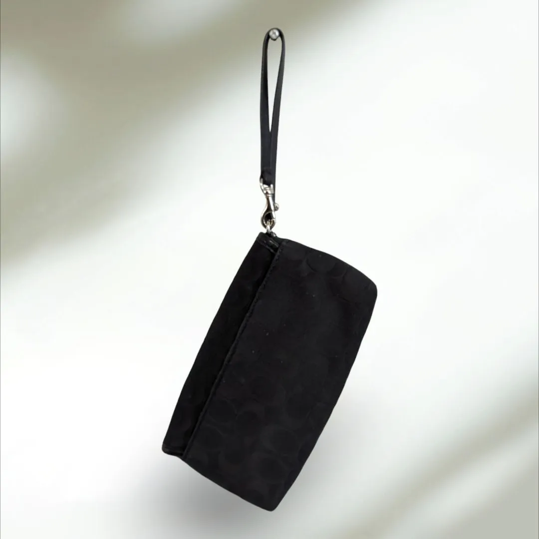COACH Signature large flap Wristlet