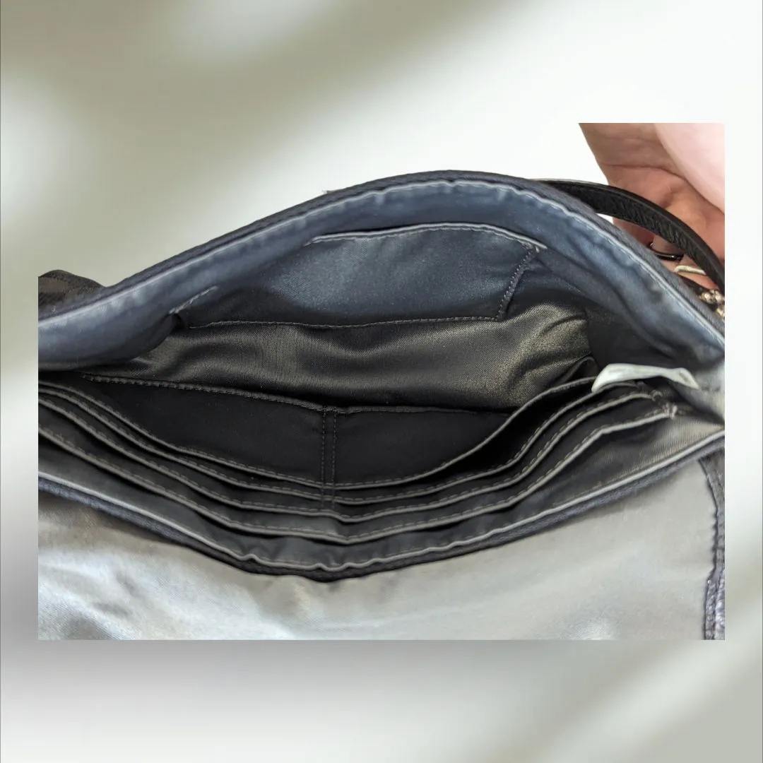 COACH Signature large flap Wristlet