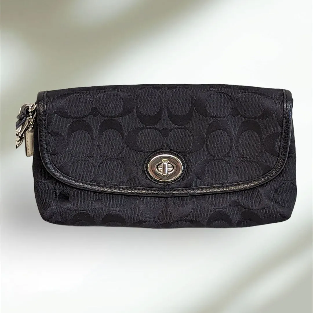 COACH Signature large flap Wristlet
